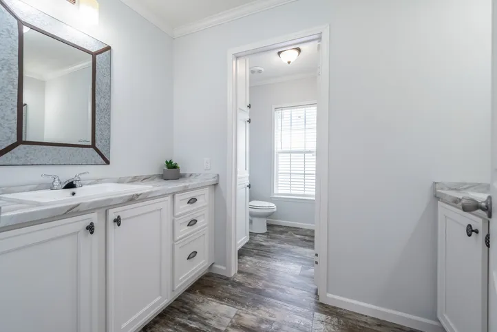 The THE LEAHY Guest Bathroom. This Manufactured Mobile Home features 4 bedrooms and 2 baths.