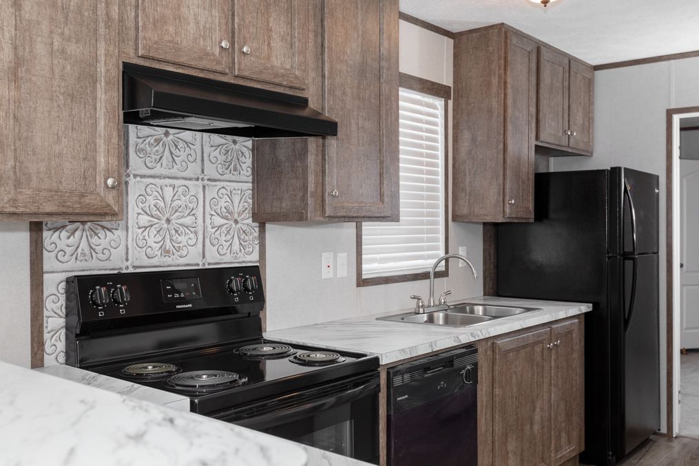 The BLAZER 66 B Kitchen. This Manufactured Mobile Home features 3 bedrooms and 2 baths.