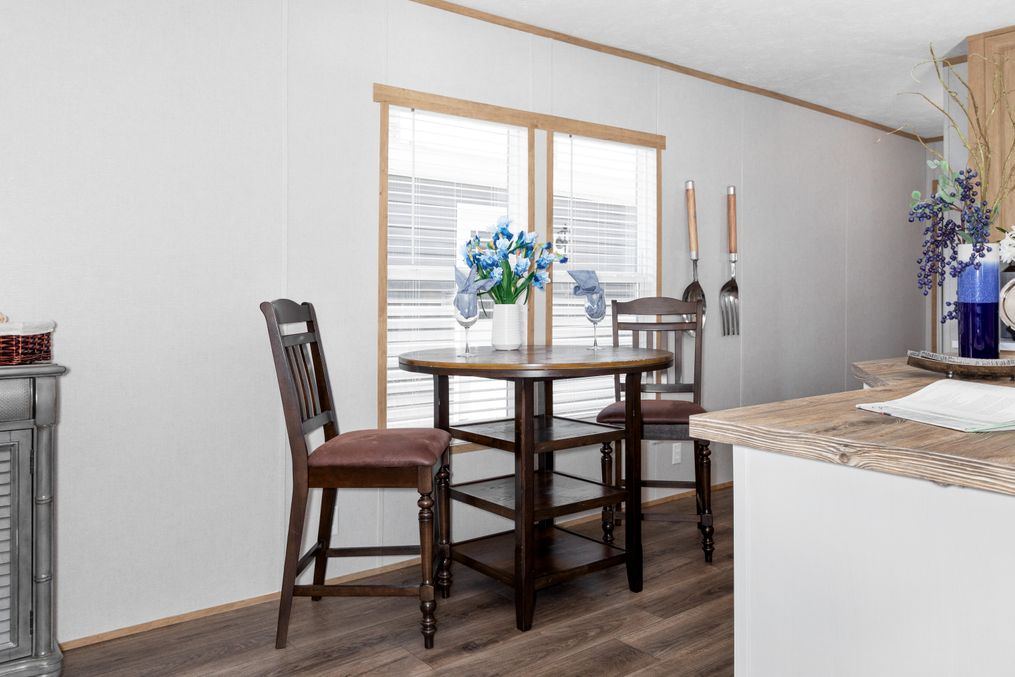 The BLAZER 76 C Dining Area. This Manufactured Mobile Home features 3 bedrooms and 2 baths.