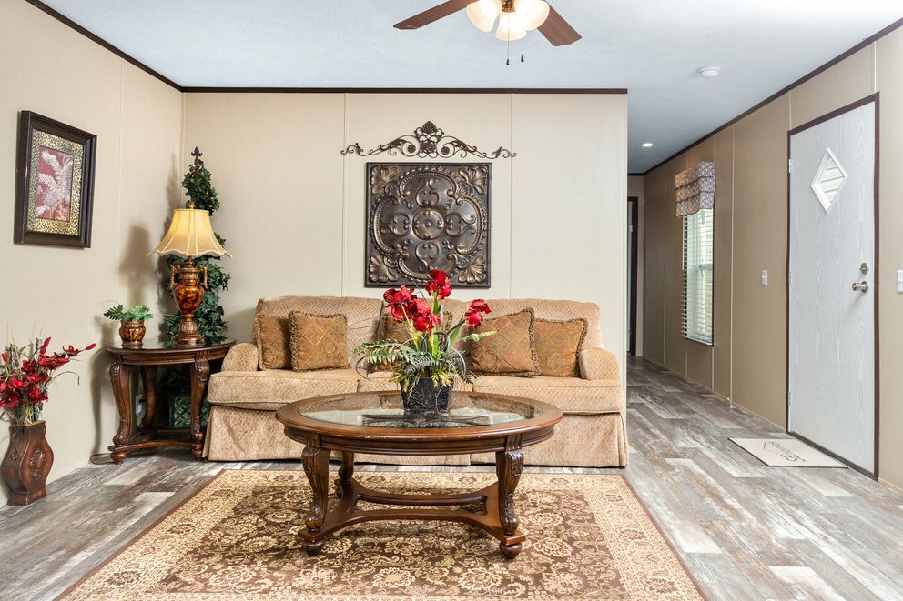 The THE SHERMAN Living Room. This Manufactured Mobile Home features 3 bedrooms and 2 baths.