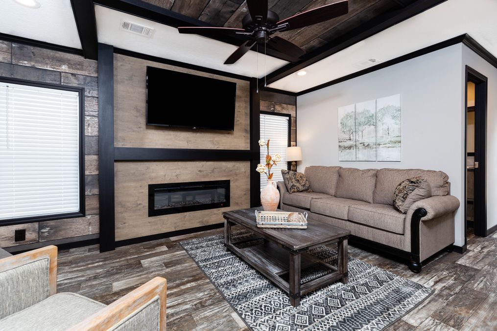 The BOUJEE XL Living Room. This Manufactured Mobile Home features 4 bedrooms and 3 baths.