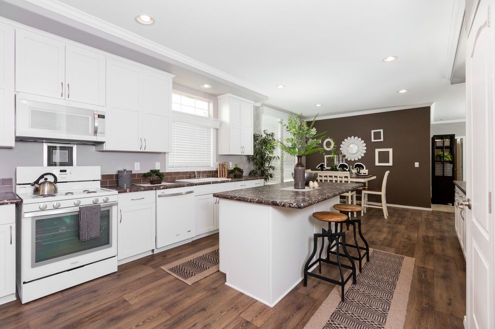 The ENCHANTMENT 3070A Kitchen. This Manufactured Mobile Home features 3 bedrooms and 2 baths.
