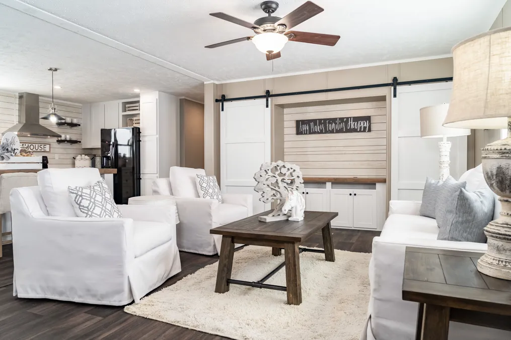 The THE RESERVE 60 Living Room. This Manufactured Mobile Home features 3 bedrooms and 2 baths.