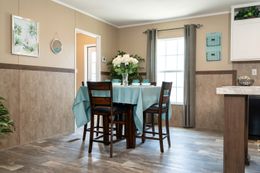 The TRADITION 60B Dining Area. This Manufactured Mobile Home features 3 bedrooms and 2 baths.
