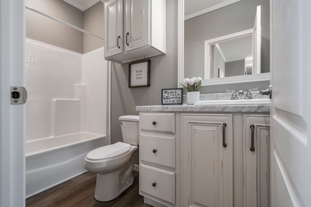 The THE ABIGAIL Guest Bathroom. This Manufactured Mobile Home features 3 bedrooms and 2 baths.