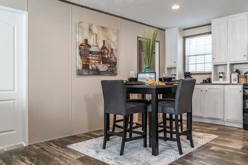 The ULTRA PRO 56B Dining Area. This Manufactured Mobile Home features 3 bedrooms and 2 baths.