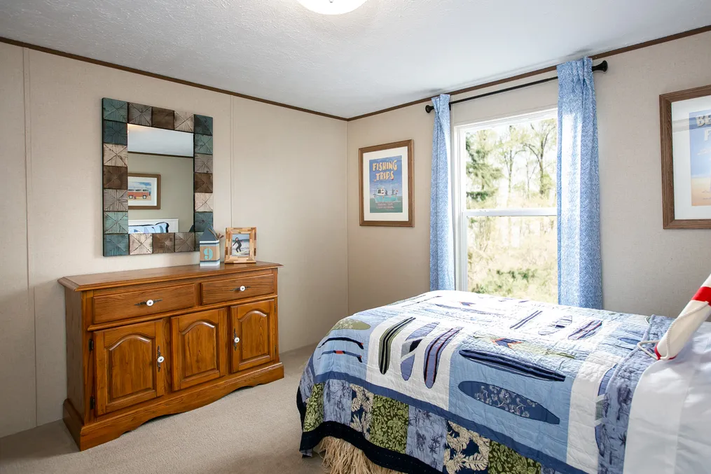 The TRIUMPH Guest Bedroom. This Manufactured Mobile Home features 5 bedrooms and 3 baths.