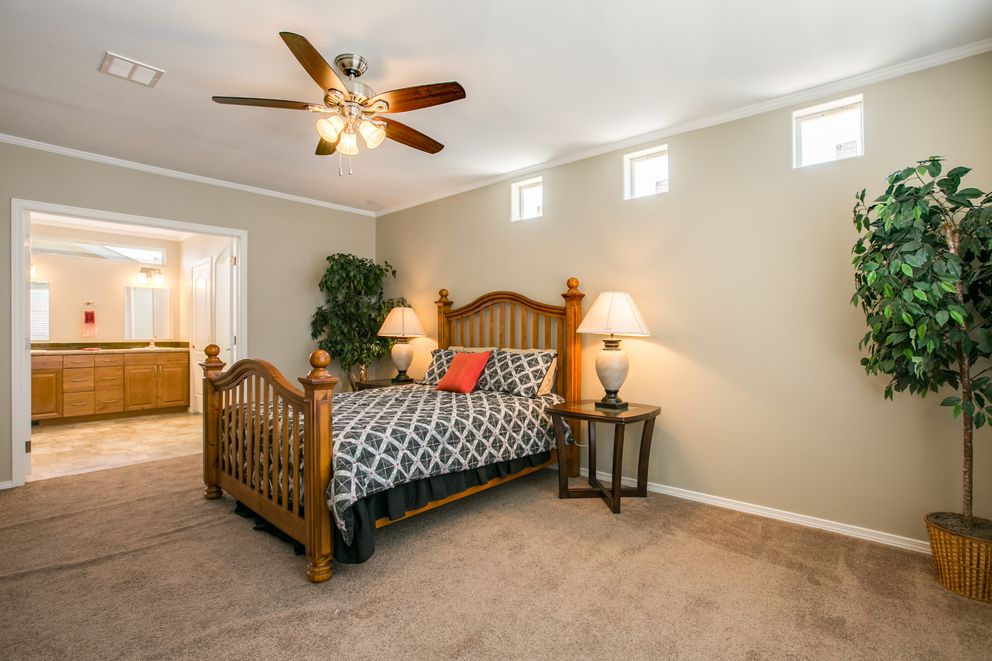 The TRANQUILITY TR3062A Primary Bedroom. This Manufactured Mobile Home features 3 bedrooms and 2 baths.