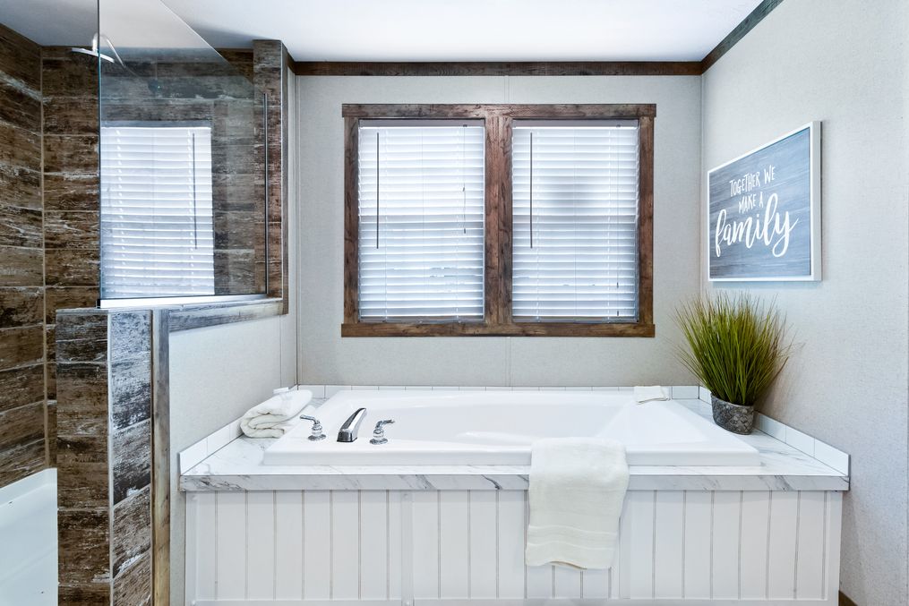 The THE MAVERICK Master Bathroom. This Manufactured Mobile Home features 4 bedrooms and 2 baths.