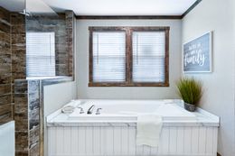 The THE MAVERICK Master Bathroom. This Manufactured Mobile Home features 4 bedrooms and 2 baths.