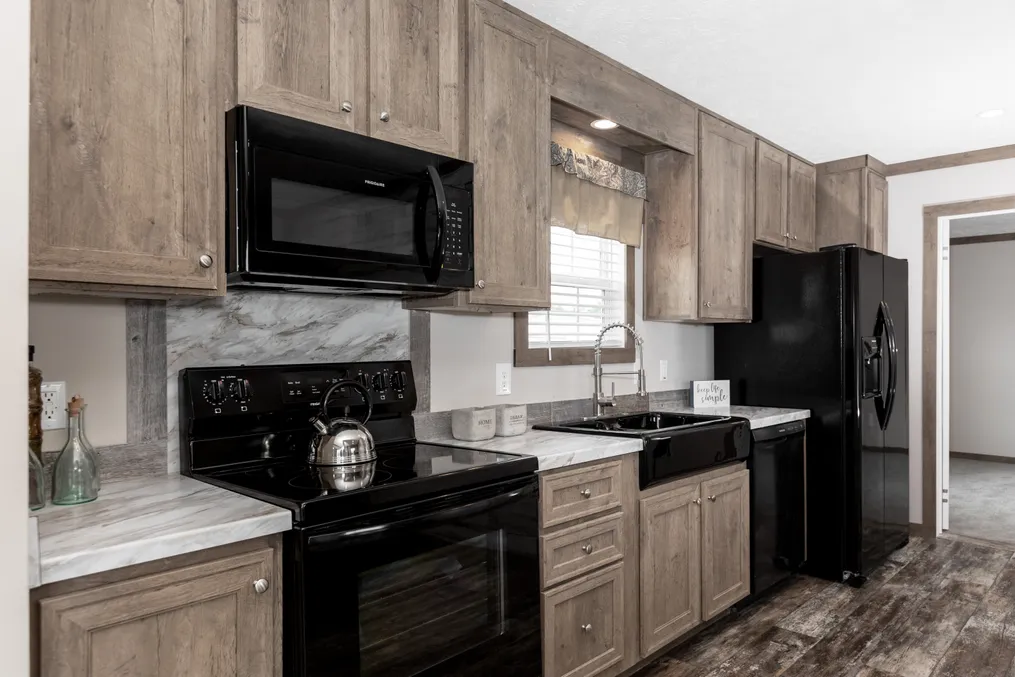 The THE WALSH Kitchen. This Manufactured Mobile Home features 3 bedrooms and 2 baths.