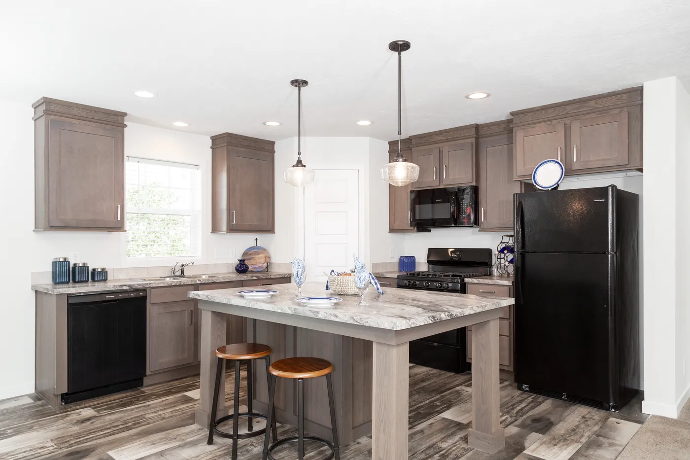 The SOMERSET DR 5228-MS012 SECT Kitchen. This Manufactured Mobile Home features 3 bedrooms and 2 baths.