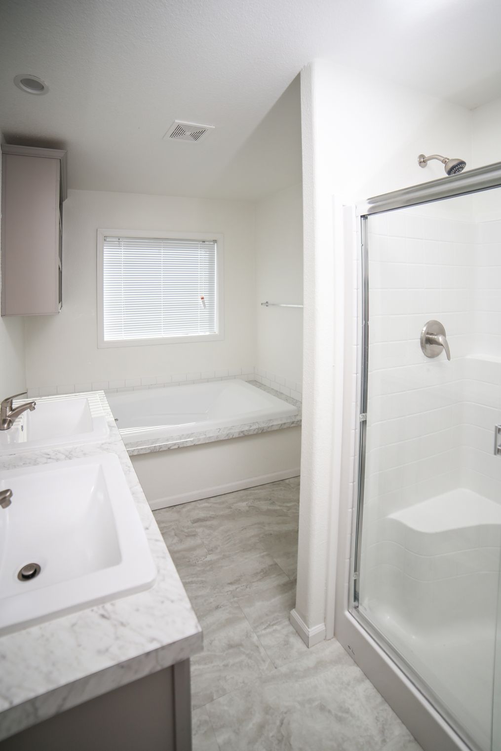 The CYAN Primary Bathroom. This Manufactured Mobile Home features 2 bedrooms and 2 baths.