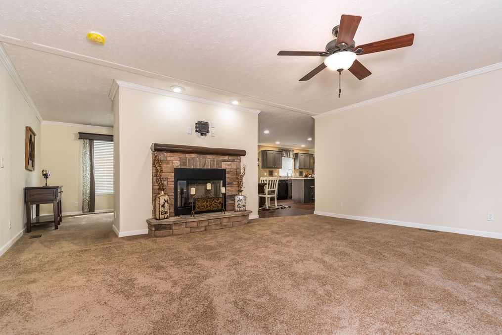 The WINCHESTER FLEX Living Room. This Manufactured Mobile Home features 4 bedrooms and 2 baths.