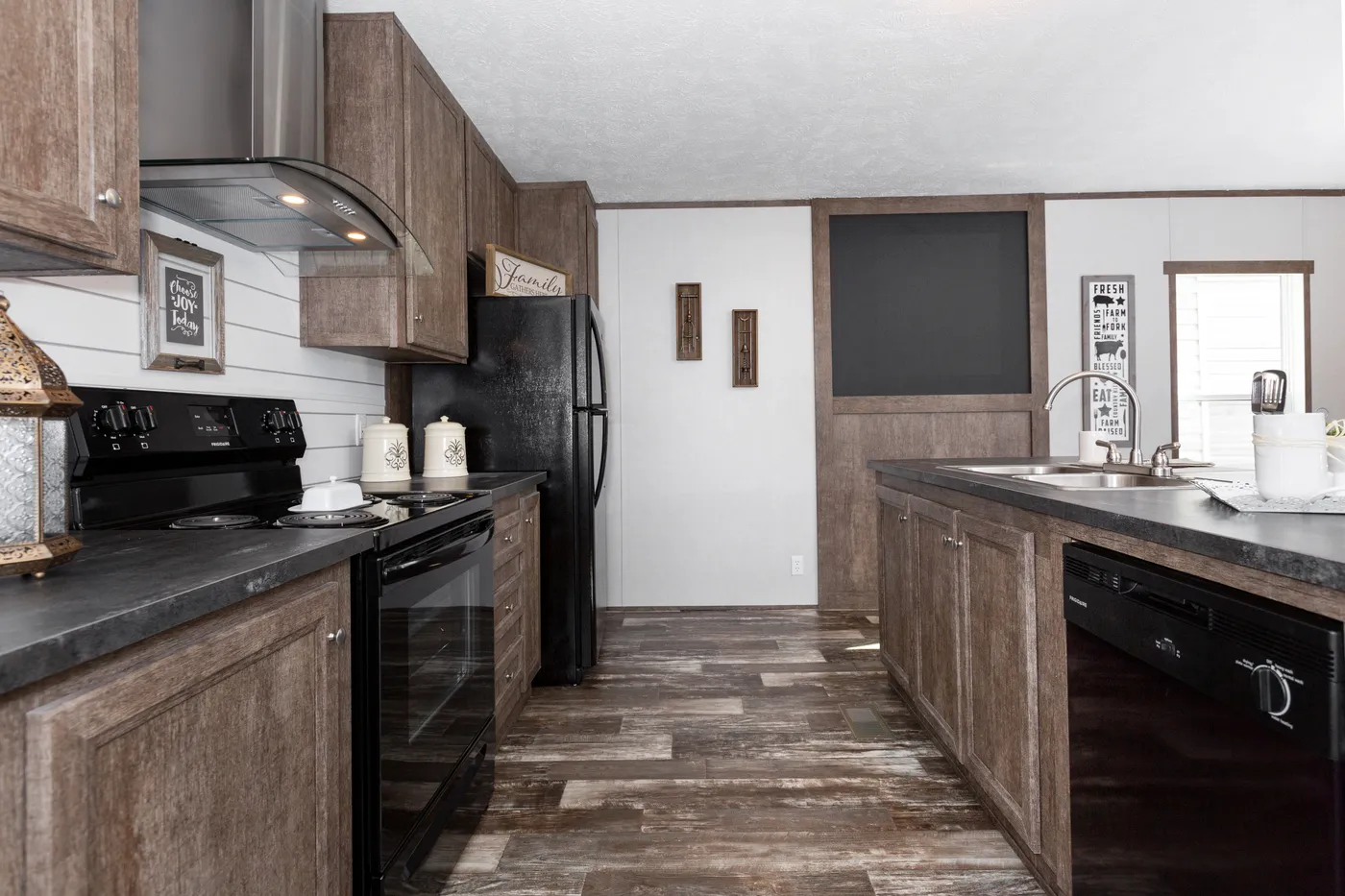 The THE BREEZE Kitchen. This Manufactured Mobile Home features 3 bedrooms and 2 baths.