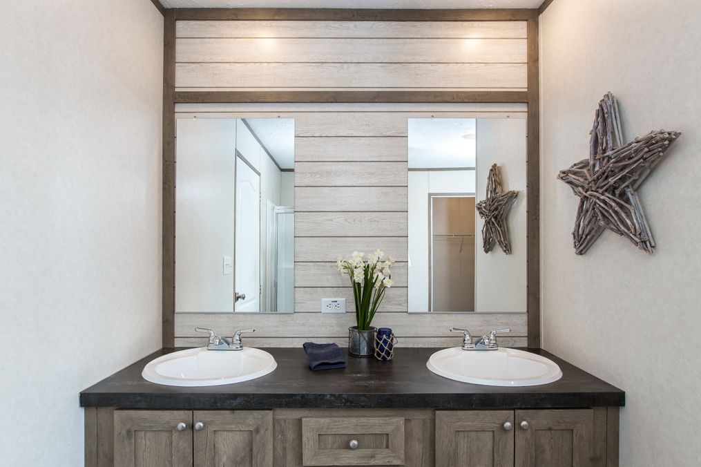 The THE NEW BREEZE II Master Bathroom. This Manufactured Mobile Home features 4 bedrooms and 2 baths.