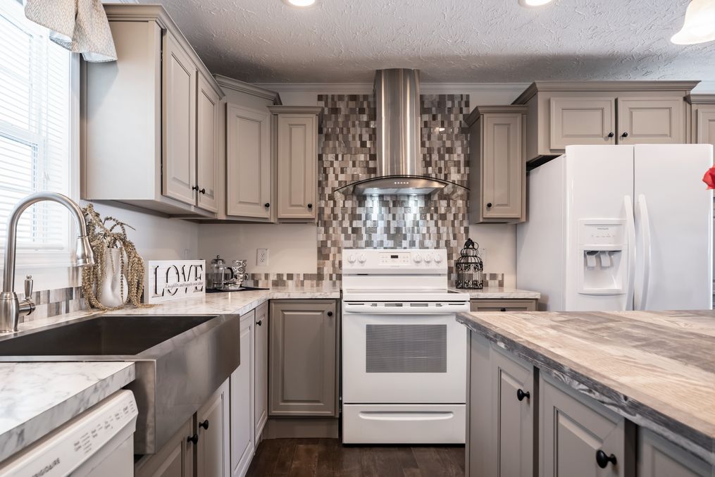 The 4620 "957 PARK AVENUE" 6428 Kitchen. This Manufactured Mobile Home features 3 bedrooms and 2 baths.