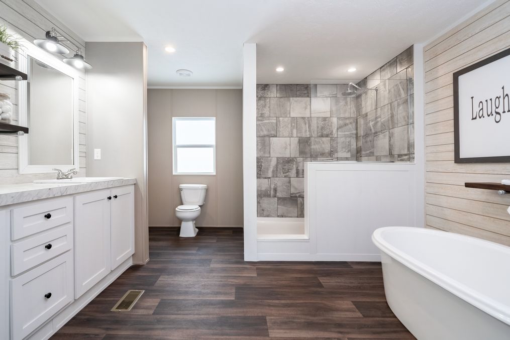 The THE RESERVE 60 Primary Bathroom. This Manufactured Mobile Home features 3 bedrooms and 2 baths.