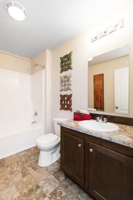 The BEVERLY PARK 6028-MS027 SECT Guest Bathroom. This Manufactured Mobile Home features 4 bedrooms and 2 baths.
