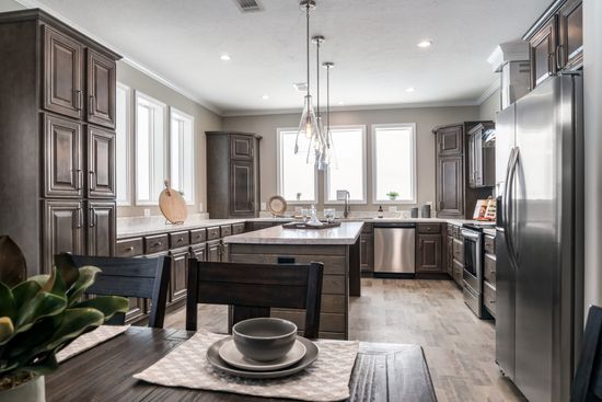 The THE HUXTON Kitchen. This Manufactured Mobile Home features 4 bedrooms and 3 baths.