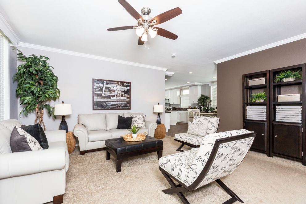 The ENCHANTMENT 3070A Living Room. This Manufactured Mobile Home features 3 bedrooms and 2 baths.