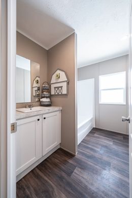 The THE RESERVE 60 Guest Bathroom. This Manufactured Mobile Home features 3 bedrooms and 2 baths.