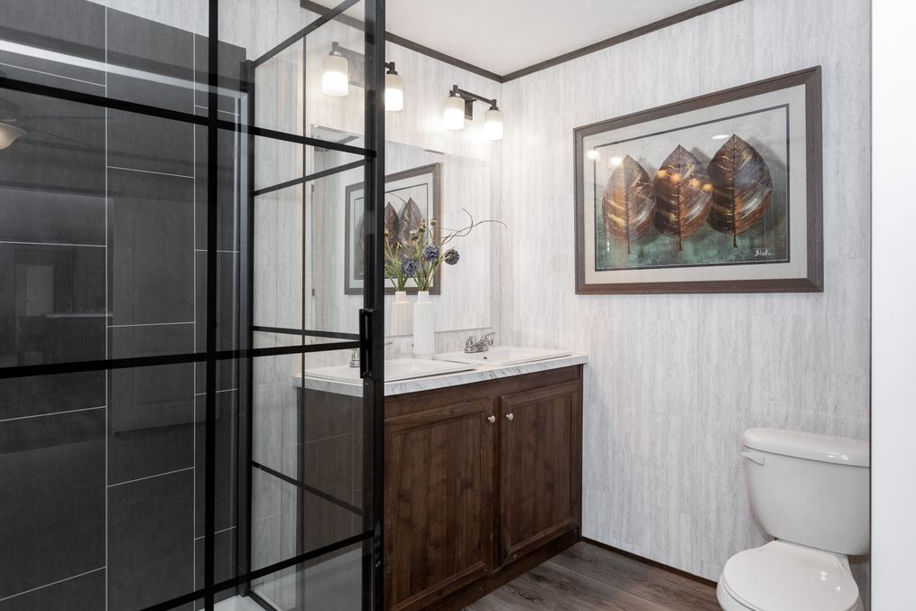 The THE REFLECTIONS Primary Bathroom. This Manufactured Mobile Home features 3 bedrooms and 2 baths.