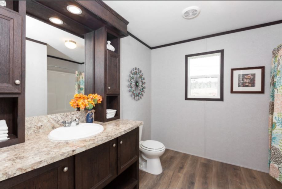 The MILANO 8016-1956 Master Bathroom. This Manufactured Mobile Home features 3 bedrooms and 2 baths.