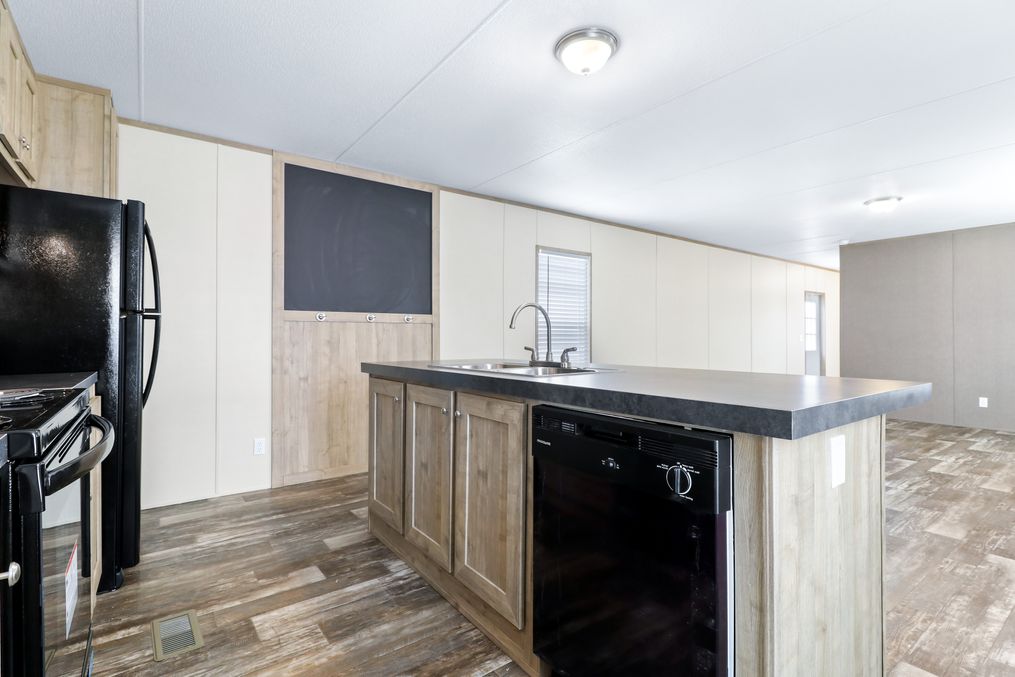 The THE BREEZE Kitchen. This Manufactured Mobile Home features 3 bedrooms and 2 baths.