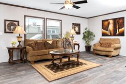 The THE CHOICE Living Room. This Manufactured Mobile Home features 4 bedrooms and 2 baths.