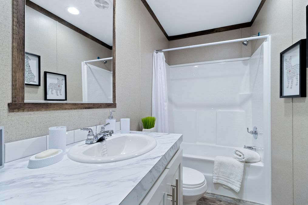 The THE MAVERICK Guest Bathroom. This Manufactured Mobile Home features 4 bedrooms and 2 baths.
