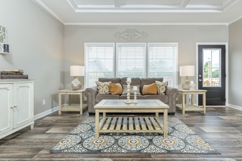 The 1714 HERITAGE Living Room. This Manufactured Mobile Home features 3 bedrooms and 2 baths.