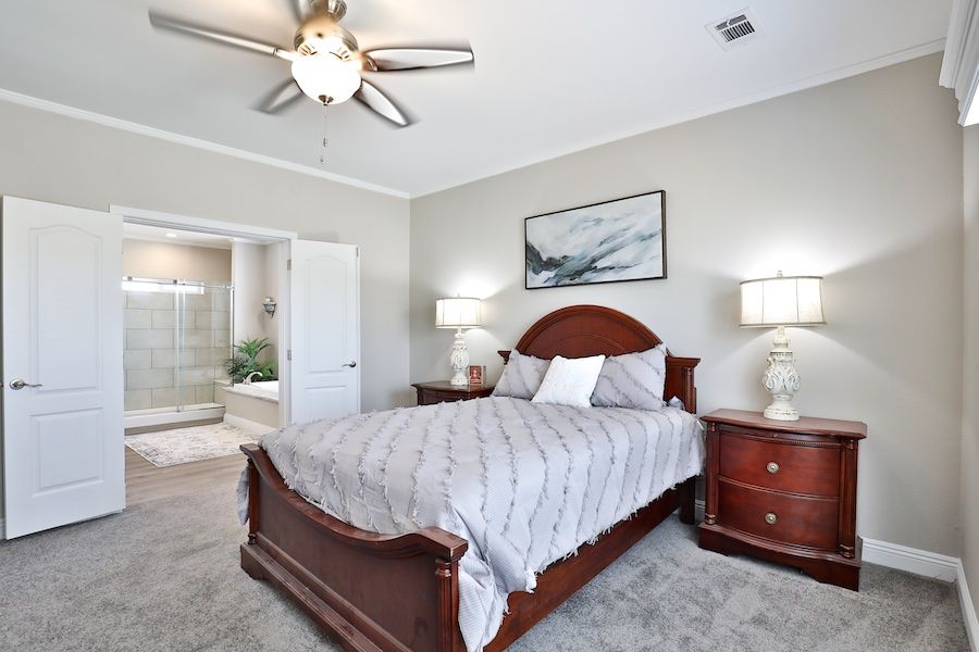 The EDGEWOOD Primary Bedroom. This Manufactured Mobile Home features 3 bedrooms and 2 baths.