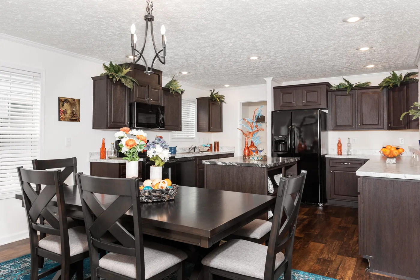 The 1321 CLASSIC Dining Area. This Manufactured Mobile Home features 4 bedrooms and 2 baths.