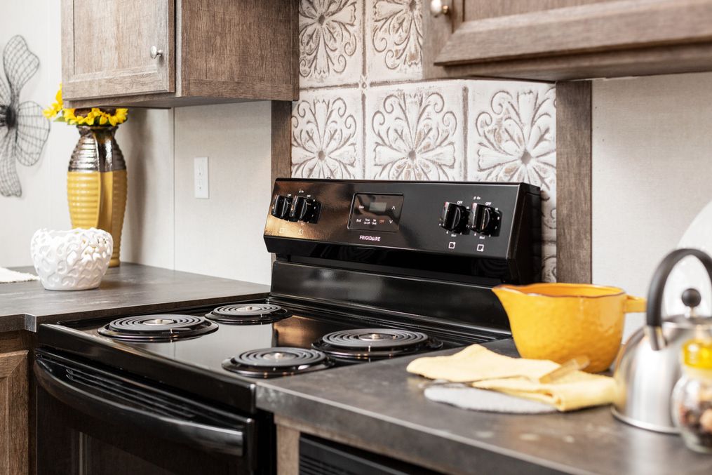 The THE ANNIVERSARY 76 Kitchen. This Manufactured Mobile Home features 3 bedrooms and 2 baths.