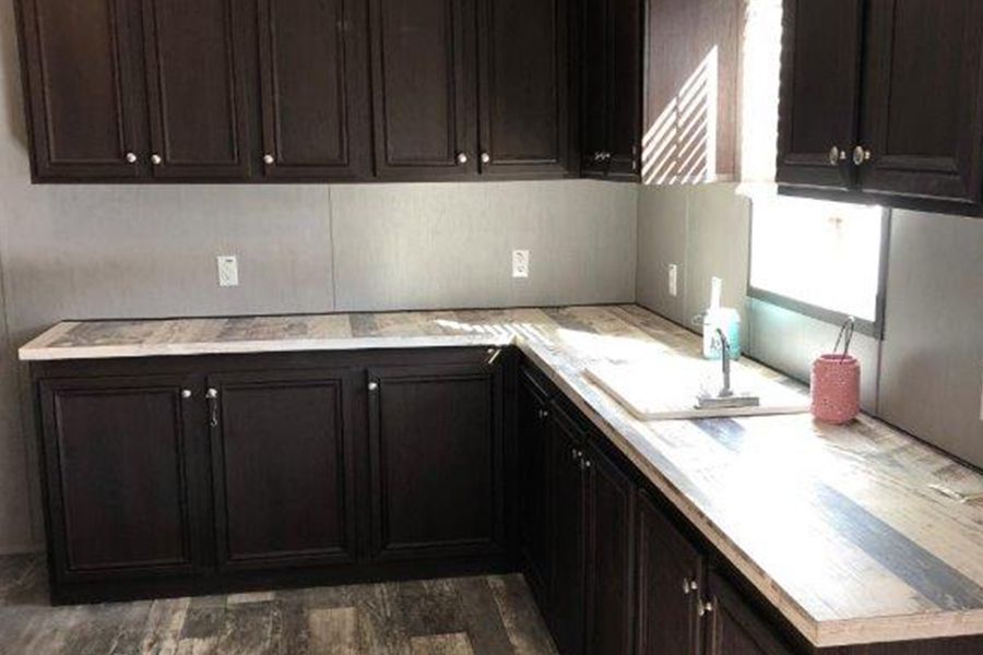 The THE MEADOWBROOK Utility Room. This Manufactured Mobile Home features 4 bedrooms and 2 baths.