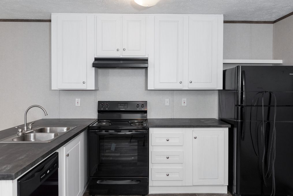 The BLAZER 76 4A Kitchen. This Manufactured Mobile Home features 4 bedrooms and 2 baths.