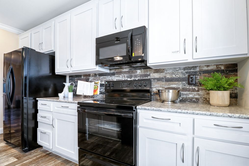 The THE TAHOE Kitchen. This Manufactured Mobile Home features 3 bedrooms and 2 baths.