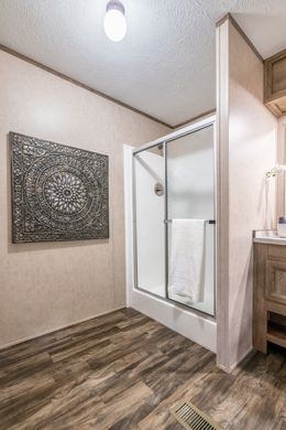 The THE SOCIAL 72 Primary Bathroom. This Manufactured Mobile Home features 3 bedrooms and 2 baths.