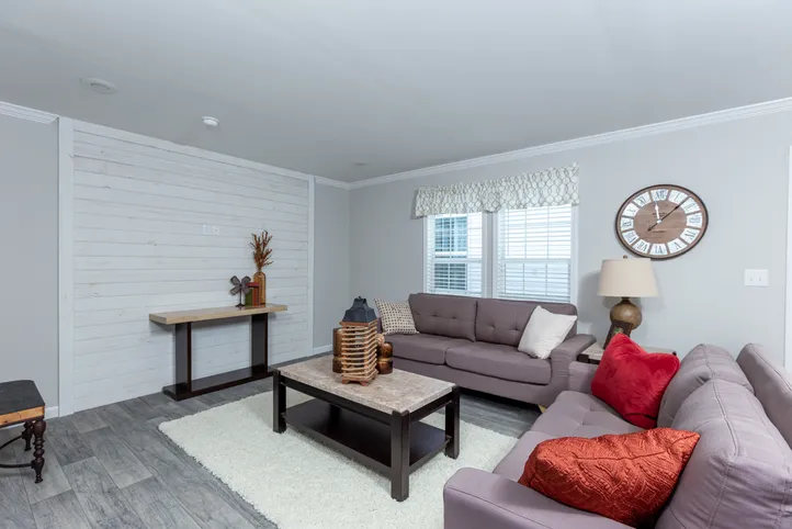 The THE FREEDOM BREEZE Living Room. This Manufactured Mobile Home features 3 bedrooms and 2 baths.