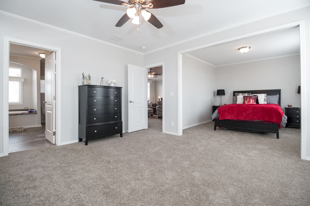The ENCHANTMENT 3070A Primary Bedroom. This Manufactured Mobile Home features 3 bedrooms and 2 baths.