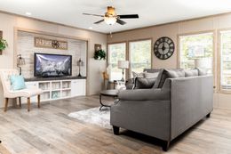 The FARMHOUSE FLEX Living Room. This Manufactured Mobile Home features 3 bedrooms and 2.5 baths.