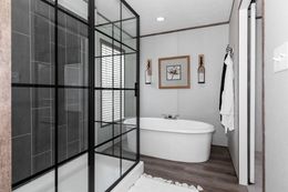 The PLATINUM ANNIVERSARY Primary Bathroom. This Manufactured Mobile Home features 3 bedrooms and 2 baths.