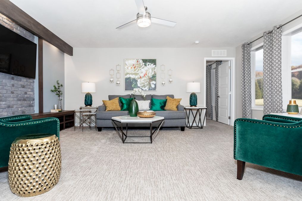 The TAYLOR 6430-9062 SECT Living Room. This Manufactured Mobile Home features 3 bedrooms and 2 baths.