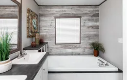 The THE SOCIAL 76 Primary Bathroom. This Manufactured Mobile Home features 3 bedrooms and 2 baths.