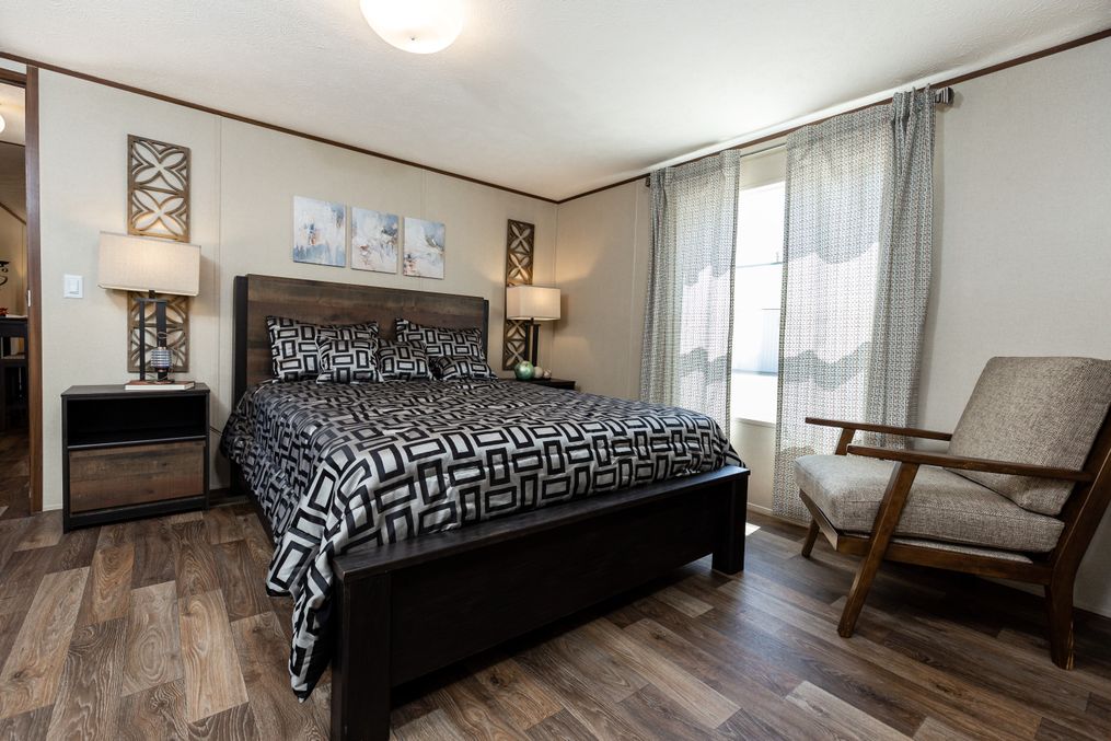 The GRAND Primary Bedroom. This Manufactured Mobile Home features 4 bedrooms and 2 baths.