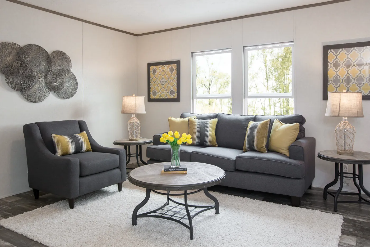 The THE BREEZE Living Room. This Manufactured Mobile Home features 3 bedrooms and 2 baths.