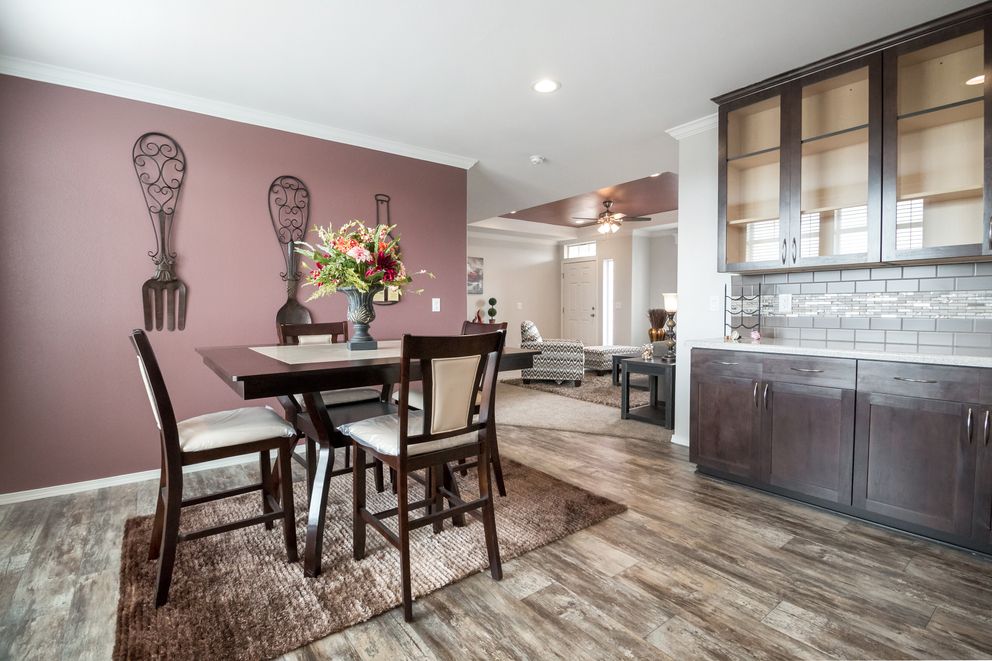The ENCHANTMENT 3070A Dining Area. This Manufactured Mobile Home features 3 bedrooms and 2 baths.