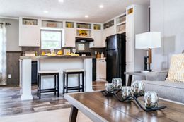 The TRADITION 2868B Living Room. This Manufactured Mobile Home features 4 bedrooms and 2 baths.