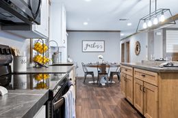The FARMHOUSE 3 Kitchen. This Manufactured Mobile Home features 3 bedrooms and 2 baths.